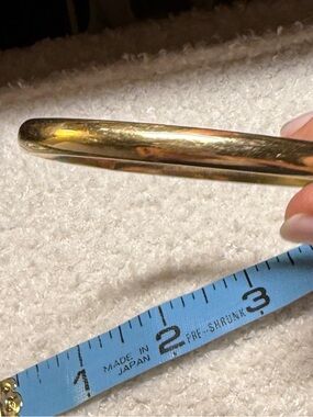 14k Yellow Gold Hinged Bangle. 
Slider-Clasp.
Very Well Loved.
8.53 grams